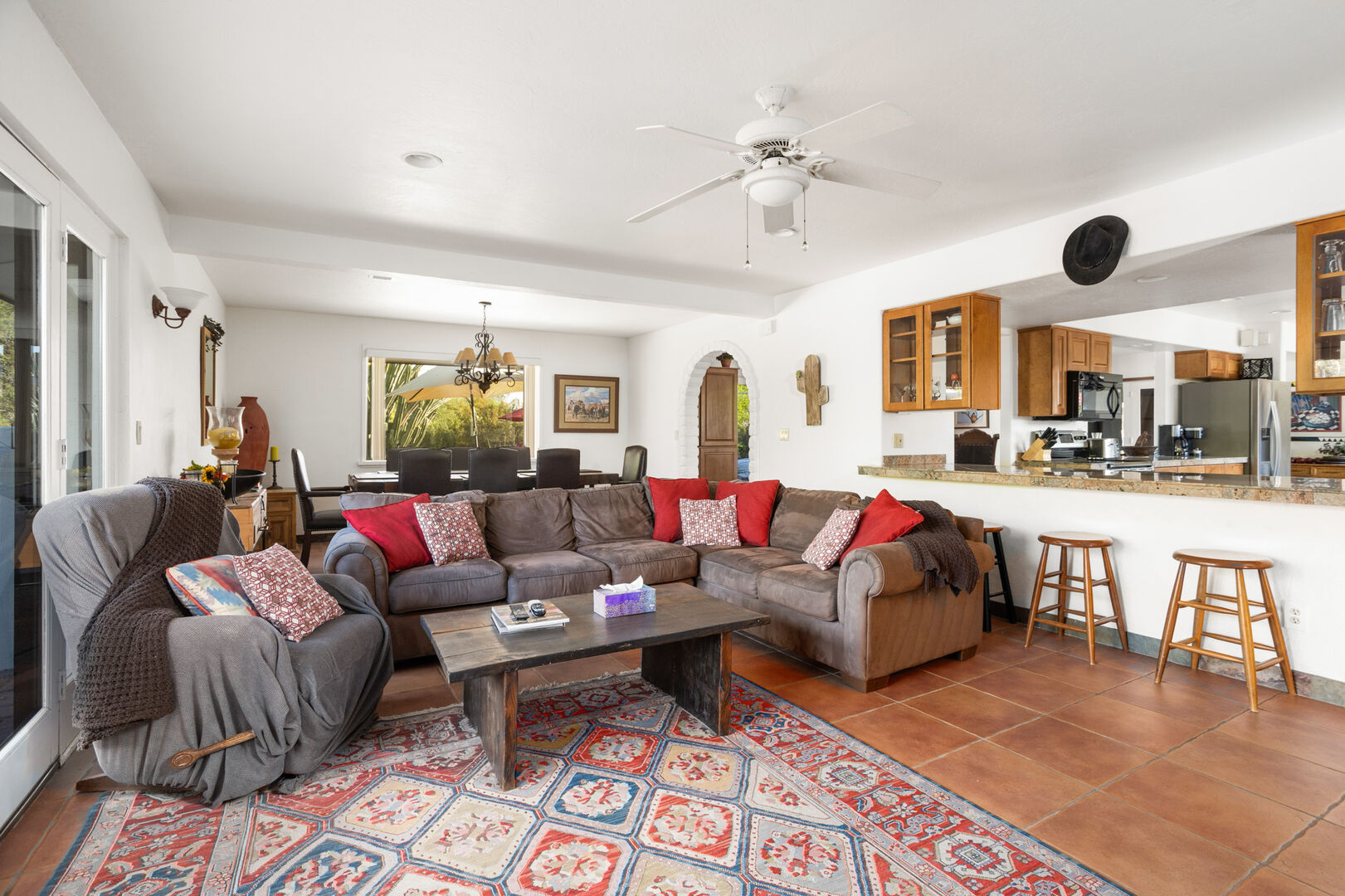 living room with couch and bartop kitchen