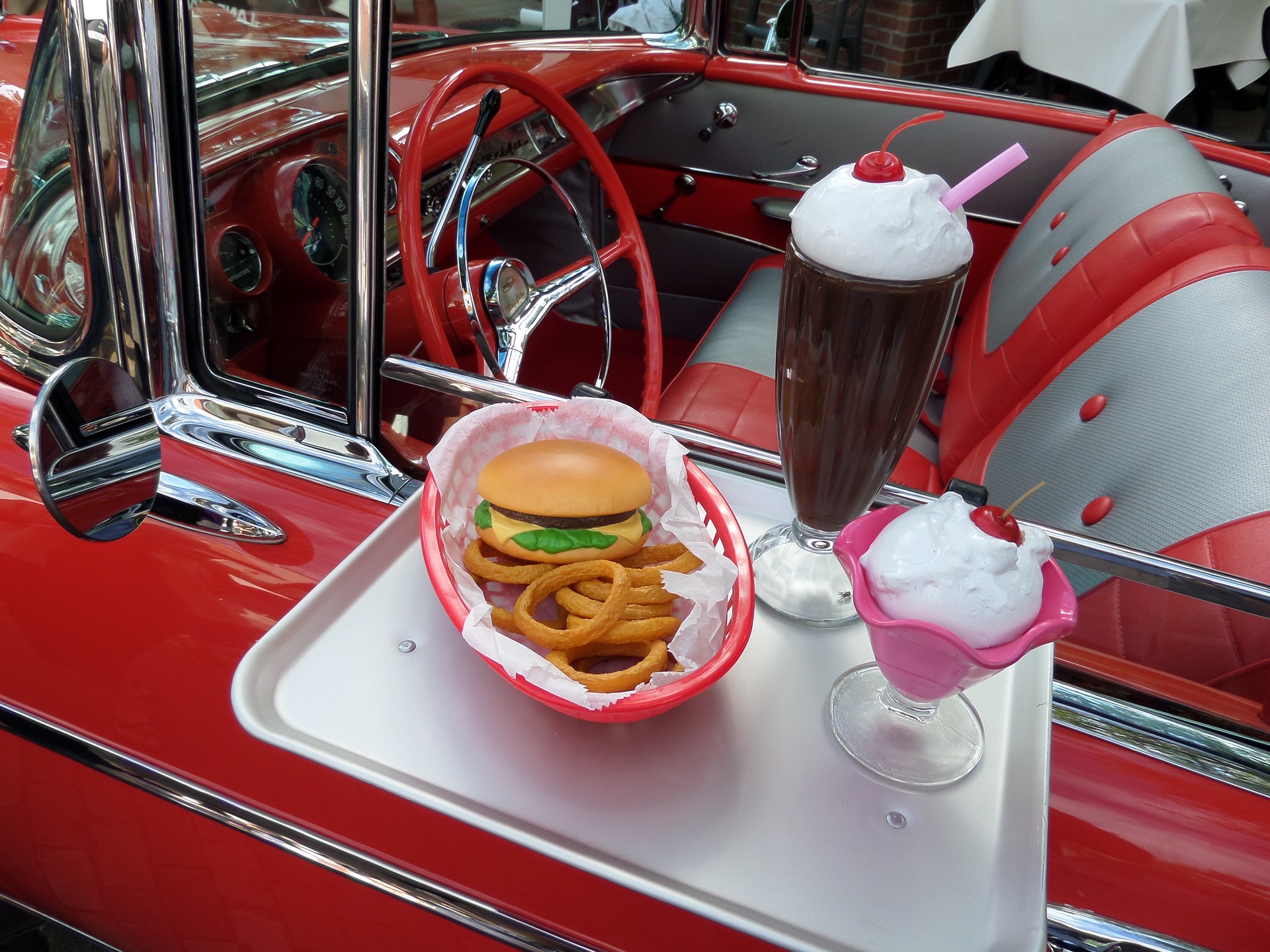 food tray on side of old car