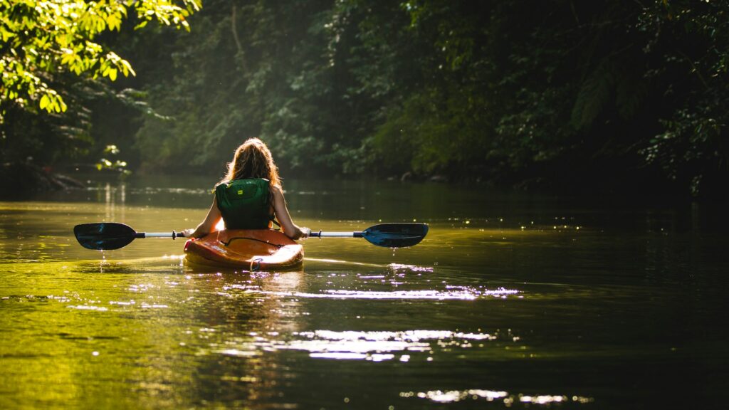 Person Kayaking on water